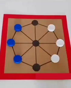 a red and brown board with circles on it