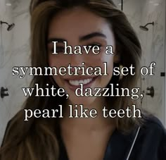 a woman with long brown hair smiling and texting i have a symmetrical set of white, dazzling, pearl like teeth