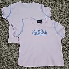 New Without Tags Von Dutch Graphic T-Shirt. Size 24 Months Baby/Kids/Toddler Tee With Incredible Amount Of Stretch. Kustommade Von Dutch Originals. Pink With Blue Graphic And Contrast Stitching Detail. 100% Cotton. Made In U.S.A. Machine Washable. Super Comfy, Super Cute Top. Several Other Sizes And Styles Of Von Dutch Tops In My Store. Smoke Free And Pet Free Home. Please Check Out My Other Items...I'd Love To Make A Discounted Bundle For You. Thank You!! Von Dutch Shirt Outfit, Von Dutch Jeans, Von Dutch Top, Von Dutch Pink Hat, Von Dutch Shirt, Pink Von Dutch Hat, Von Dutch, Pleated Jacket, Yellow T Shirt