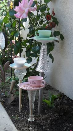 three tiered dishes and cups are on display outside