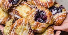 blueberry scones with icing and drizzled on top in a bowl