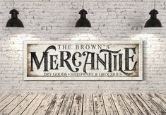 the brown's mergannie dry goods hardware & groceries sign on a brick wall