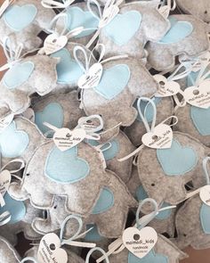 several gray and blue teddy bears with tags on them