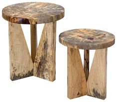 two wooden stools sitting next to each other