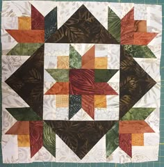 a close up of a quilt on a table