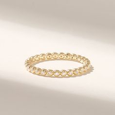 The 14k Solid Gold Ball Ring is a delicate and elegant piece of jewelry that exudes simplicity and sophistication. This dainty ring features a continuous row of tiny, gleaming balls in solid 14k gold, making it a minimalist and timeless choice. Features * Made to Order. * Gold KT: 10K, 14K, 18K * Custom Gold Color: Rose Gold, Yellow Gold, White Gold * Width of Band: 2.10MM * Thickness of Band: 1.70MM * Total Carat: 0.11ctw * Ready to Ship in 5-7 Business Days ✓ We care about the environment,the jewelry we cast is made with recycled gold. We source exclusively post-consumer material that is refined back to their pure elements to ensure that the gold is in the same quality. Our designs are made from 14k/18k/10k real solid gold ✓ We care about customer satisfaction and long-term relationship Minimal Wedding Ring, Bucksport Maine, Minimal Wedding Rings, Diamond Bubble Ring, Delicate Stacking Rings, Wedding Ring Women, Ring Minimal, Bubble Ring, Dot Ring