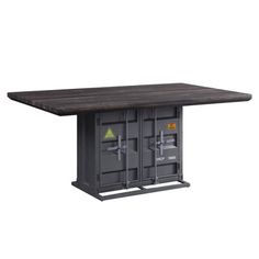 a table with two metal lockers on the top and one door open to reveal an electrical outlet