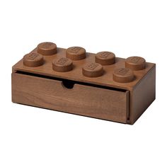 a wooden toy box with four different sized knobs on the front and one in the middle