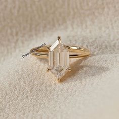 an engagement ring with a baguette cut diamond