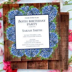 an image of a birthday party with blue flowers on the front and back of it