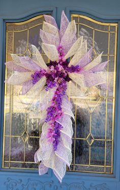 This beautiful Easter/Mother's Day Cross is made of lavender and white Poly Burlap Mesh on a wire frame with artificial flower accents. It can be used as either a wall hanging, door wreath, or Easter Grave Marker for your lived one. Hanging Door, Grave Marker, Wire Frame, Door Wreath, Cemetery, Door Wreaths, Artificial Flowers, Burlap, Mother's Day