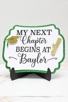 a sign that says, my next charter begins at baylor on top of a table