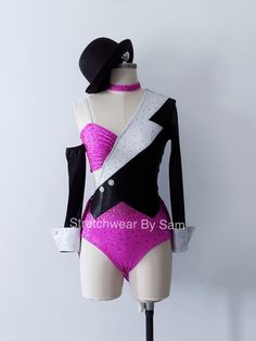 a female mannequin wearing a pink and black suit with white trimmings