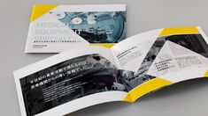 an open brochure is displayed on a gray surface with yellow accents and black lettering