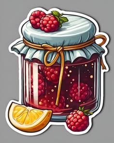 a jar filled with raspberry jam next to a slice of lemon