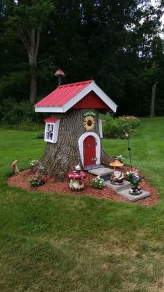 a small tree house with a red roof