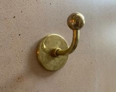 an old brass hook on the wall