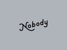 the word nobody written in black ink on a gray background