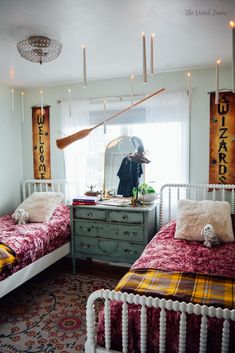 two twin beds in a room with lights