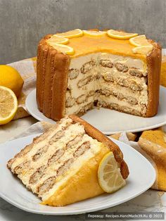 two slices of cake on plates with lemons