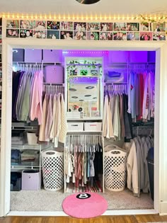 an organized closet with clothes and other items on the shelves in front of it,