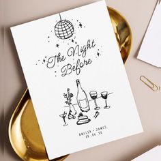 there is a card with the words the night before and two glasses of wine on it