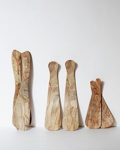 three pieces of wood sitting next to each other