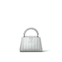 Crafted from precious lizard leather, this capucines mini bag is lined with luxurious goatskin and fitted with gleaming metal hardware. Perfect for evening use, this petite bag features the distinctive capucines flap, which can be tucked in to display the lv signature or worn outside to reveal a monogram flower. Louis Vuitton Gifts, Trunk Bag, Buckle Shoes, Wallet Pouch, Fashion Jewelry Earrings, Wallet Chain, Spring Shoes, Chain Bags