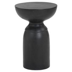 a black vase sitting on top of a table