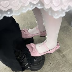 two pairs of pink shoes sitting on top of each other