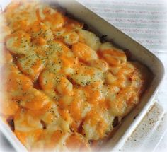 a casserole dish with cheese and herbs