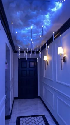 a hallway that has some lights on the ceiling and clouds in the sky above it