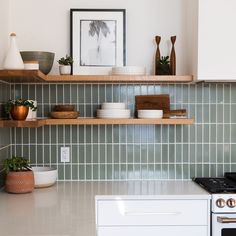 the kitchen counter is clean and ready to be used as a shelf for cooking utensils