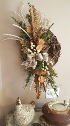 a christmas wreath is hanging on the wall next to other ornaments and decorating items