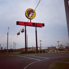 a large sign that says awesome food on it