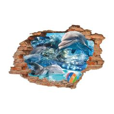 dolphins swimming in the ocean through a hole in a brick wall that has been painted on