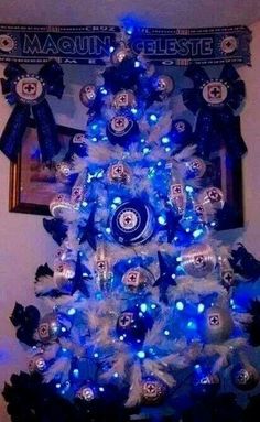 a blue and white christmas tree with lights