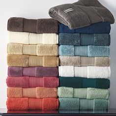 towels stacked on top of each other in different colors