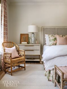 a bedroom with wicker furniture and white bedding