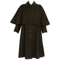 1970's Yves Saint Laurent green wool coat with cape overlay and button closure. In excellent condition. MEASUREMENTS: Shoulder - 14" Length - 40" Dark Academia Coat, Coat With Cape, Hogwarts Style, Dark Academia Sweater, 1970s Coat, Dark Green Coat, Green Wool Coat, Wool Cape Coat, Jacques Fath