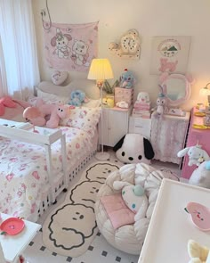 a bedroom with hello kitty bedding and furniture