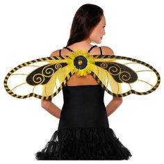 a woman wearing a black and yellow butterfly costume