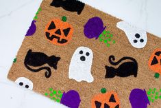 a door mat with halloween decorations on it