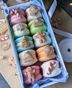 a box filled with lots of different colored cookies