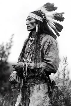 an old black and white photo of a native american man