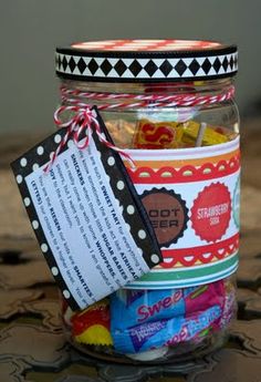 a jar filled with candy sitting on top of a table