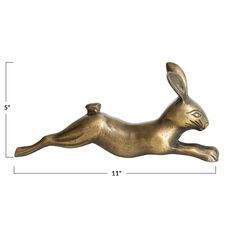 a brass colored rabbit figurine is shown with measurements for the size and height