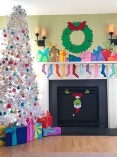 a decorated christmas tree sitting in front of a fireplace