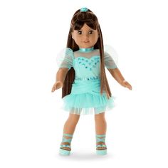 a doll with long brown hair wearing a blue dress