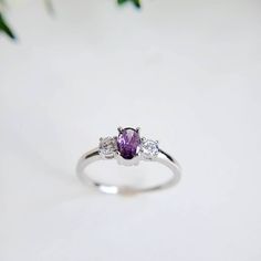 Dainty Amethyst Sterling Silver Ring, Bride, Promise, Anniversary, Engagement Size 4 - 12 Top Of Ring Height: 4mm Band Width: 1.3mm Stones: Lab Created Amethyst & Cz Clear Stones Center Stone Size: 6mm X 4mm Stone Shape: Emerald Cut Total Number Of Cz Stones: 2 Stone Setting: Prong Setting Metal: 925 Sterling Silver Plating: Rhodium Plated (To Prevent Tarnish) Finish: High Polish K E E P I N T O U Ch Https://Instagram.Com/Emmaverajewelry Https://Www.Facebook.Com/Emmaveradesign Thank You For Visi Brides Ring, Ring Bride, Stone Setting, Clear Stone, Ring Promise, Amethyst Ring, Cz Stone, Promise Ring, Stone Settings